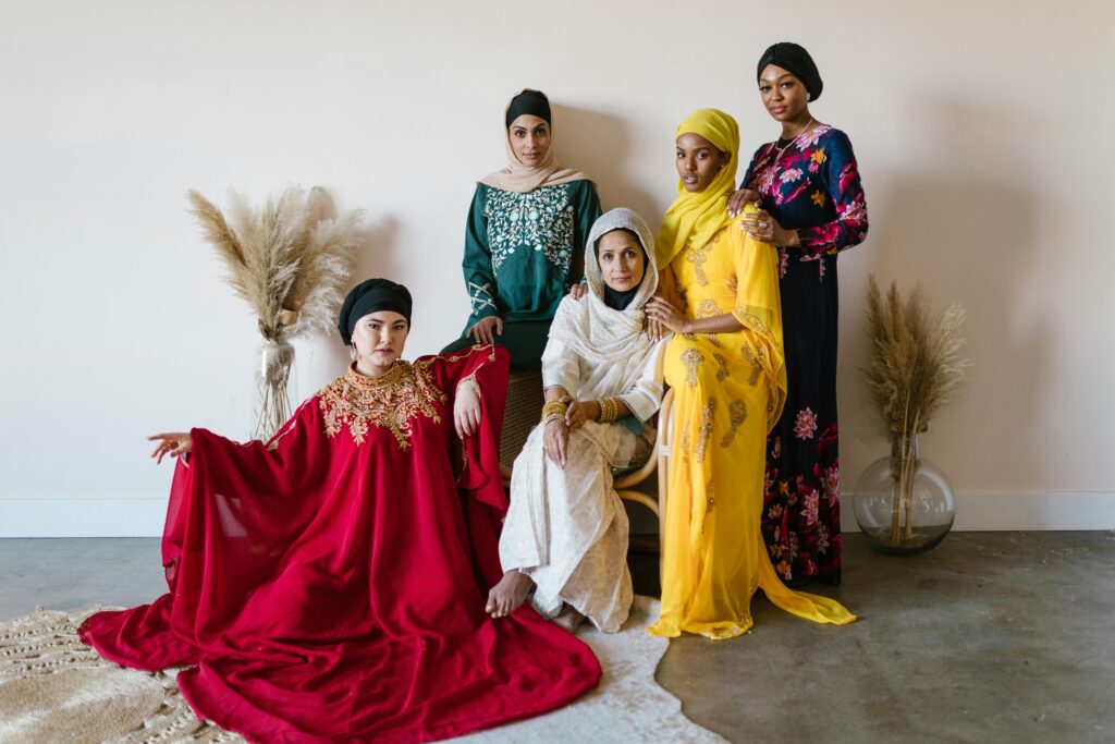 A diverse group of women showcasing traditional attire, capturing cultural elegance and unity.